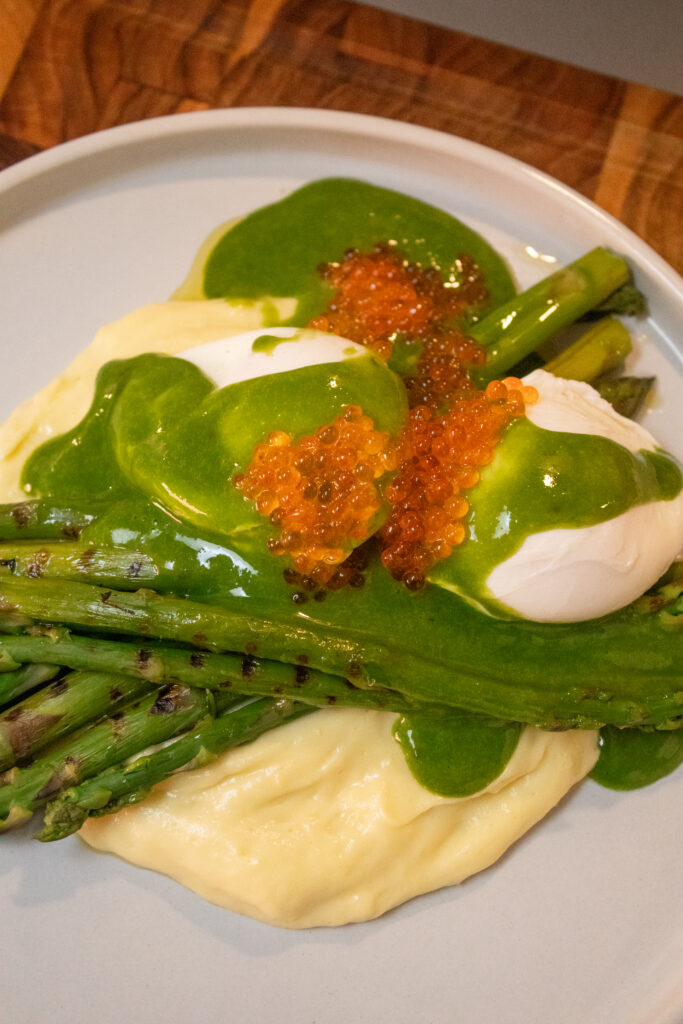 Green Asparagus with Mashed Potatoes, Poached Eggs, Spinach Sauce and Trout Caviar